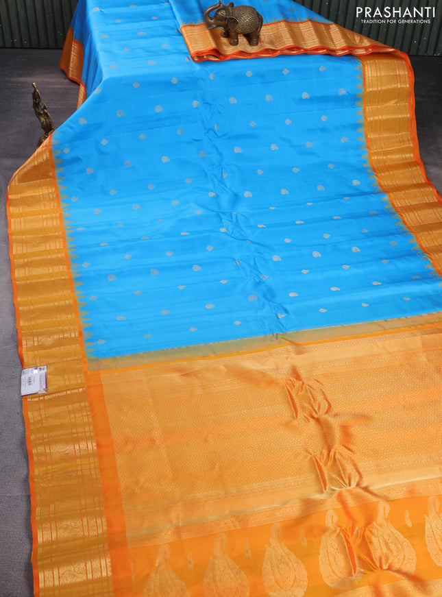 Pure gadwal silk saree light blue and orange with zari woven buttas and temple design zari woven border