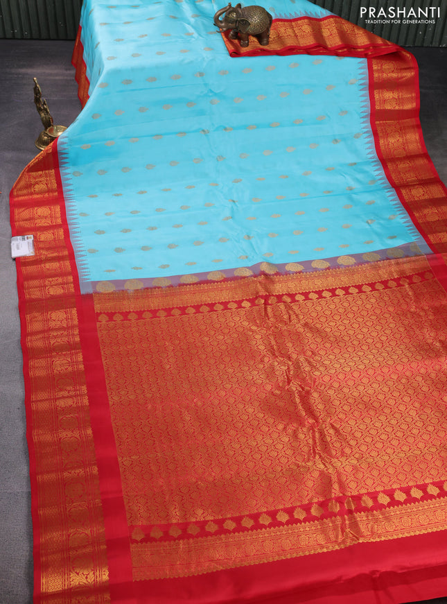 Pure gadwal silk saree light blue and red with zari woven buttas and temple design zari woven border