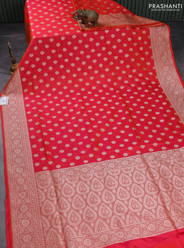 Banarasi uppada silk saree dual shade of pinkish orange with allover zari woven butta weaves and zari woven border