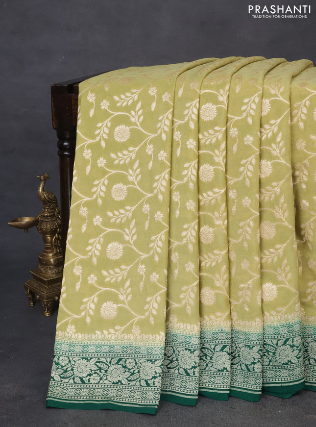 Banarasi crepe saree pista green and green with allover thread & zari weaves and woven border