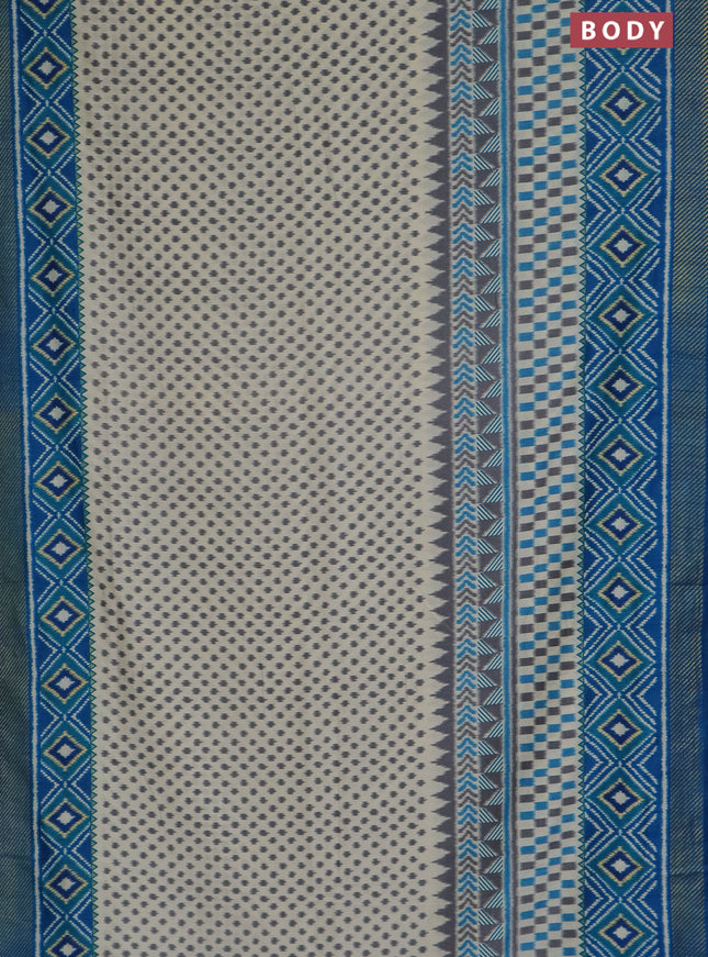 Semi patola saree off white and cs blue with allover ikat weaves and zari woven border