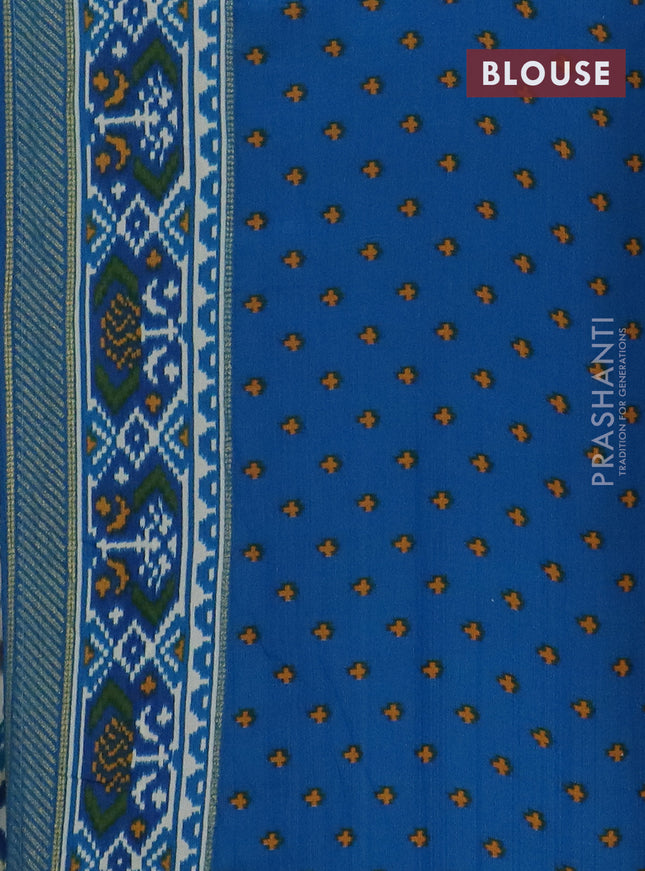 Semi patola saree off white and cs blue with allover ikat weaves and zari woven border