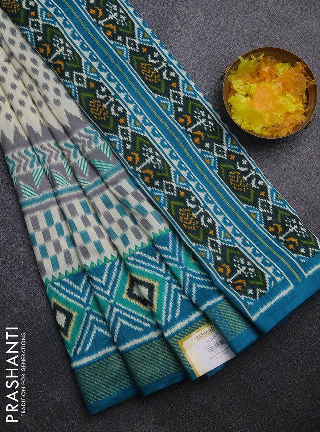 Semi patola saree off white and teal blue with allover ikat weaves and zari woven border