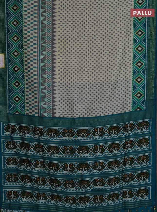 Semi patola saree off white and teal blue with allover ikat weaves and zari woven border