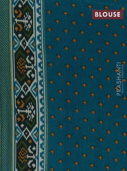 Semi patola saree off white and teal blue with allover ikat weaves and zari woven border