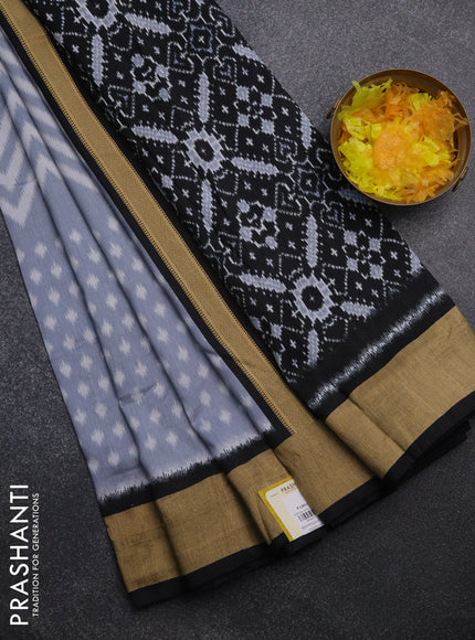 Semi patola saree pastel grey and black with allover ikat weaves and woven border
