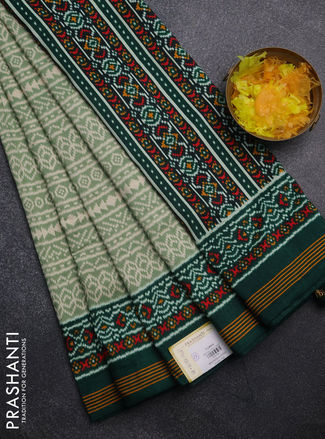 Semi patola saree pastel green and dark green with allover ikat prints and simple border