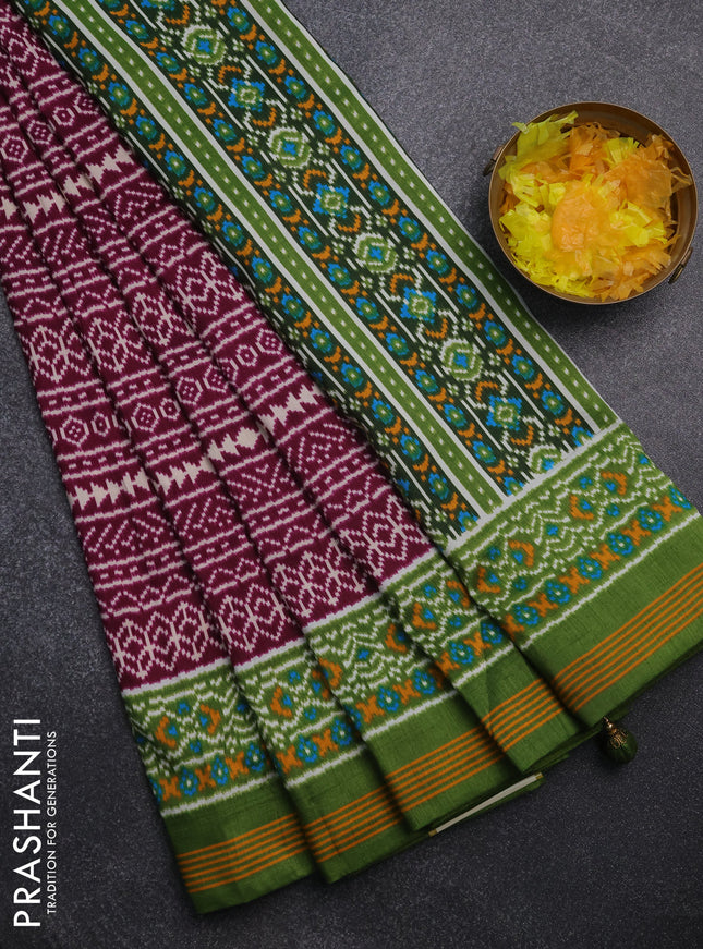Semi patola saree wine shade and green with allover ikat prints and simple border