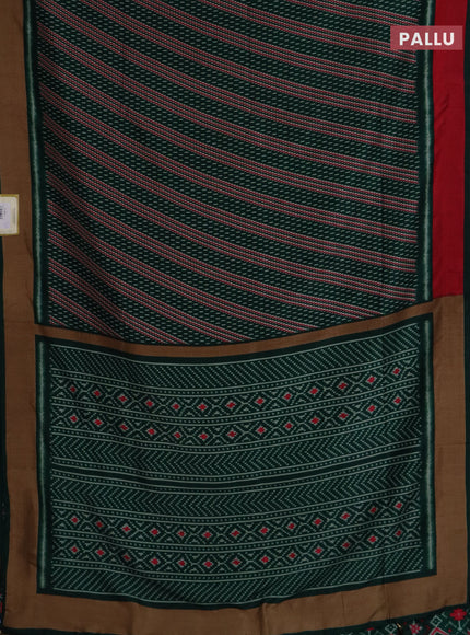 Semi patola saree dark green with allover prints and woven border