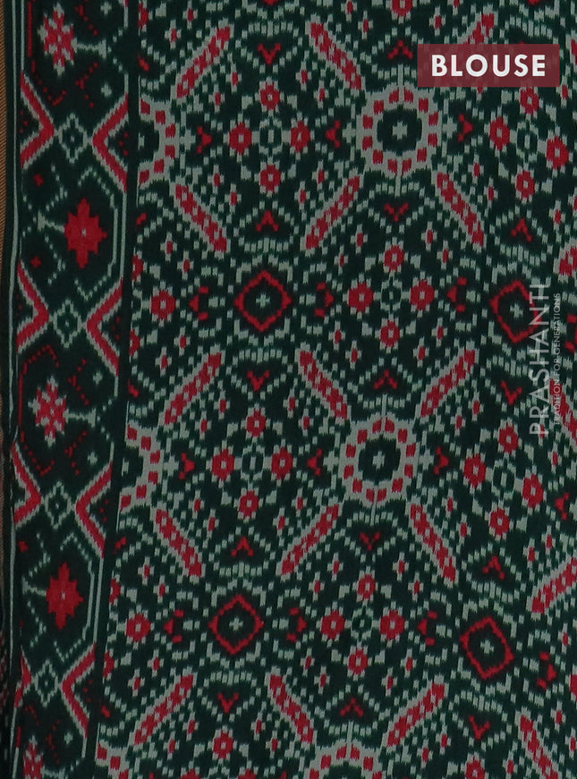 Semi patola saree dark green with allover prints and woven border