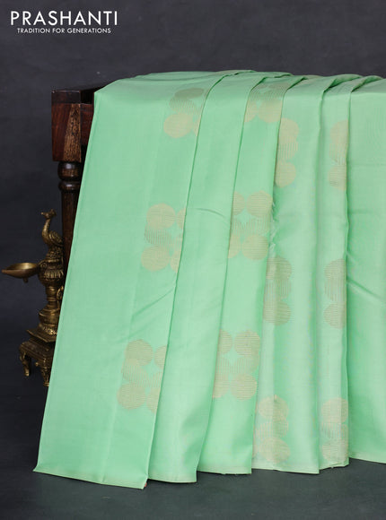 Kanchipuram silk saree pastel green and deep maroon with zari woven geometric buttas in borderless style