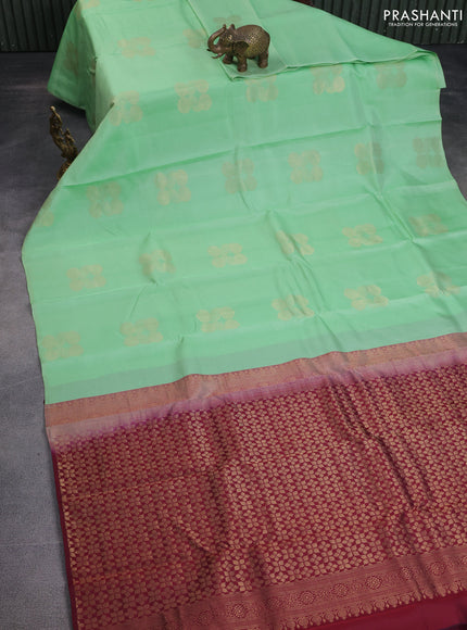 Kanchipuram silk saree pastel green and deep maroon with zari woven geometric buttas in borderless style