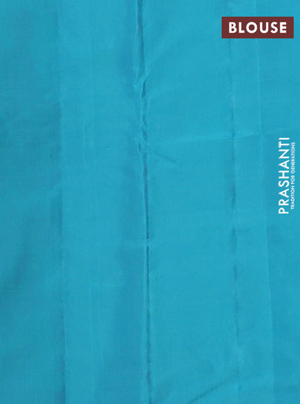 Kanchipuram silk saree dual shade of pinkish orange and teal blue with zari woven buttas in borderless style