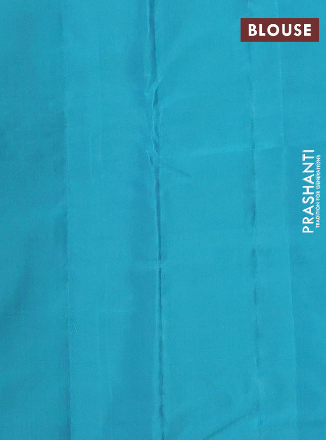 Kanchipuram silk saree dual shade of pinkish orange and teal blue with zari woven buttas in borderless style