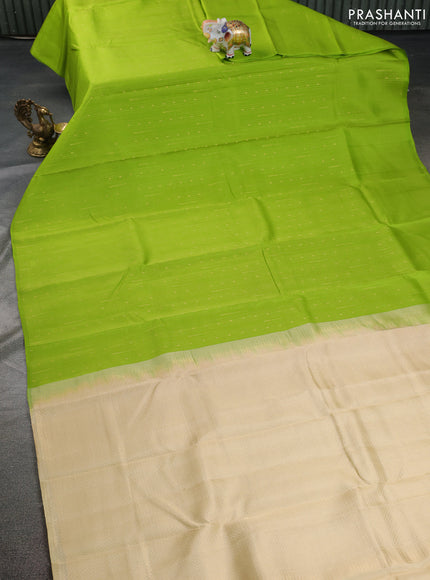 Kanchipuram silk saree light green and cream with allover zari weaves in borderless style