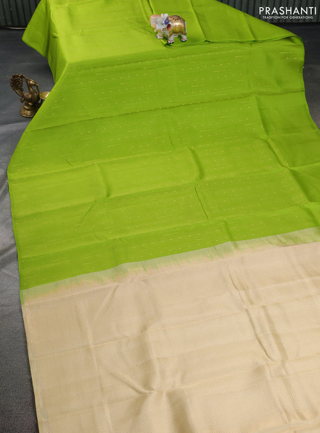 Kanchipuram silk saree light green and cream with allover zari weaves in borderless style
