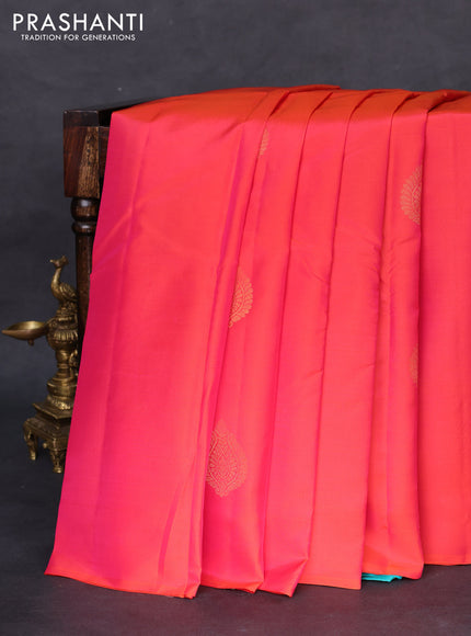 Kanchipuram silk saree dual shade of pinkish orange and teal blue with zari woven buttas in borderless style