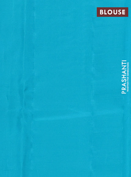 Kanchipuram silk saree dual shade of pinkish orange and teal blue with zari woven buttas in borderless style