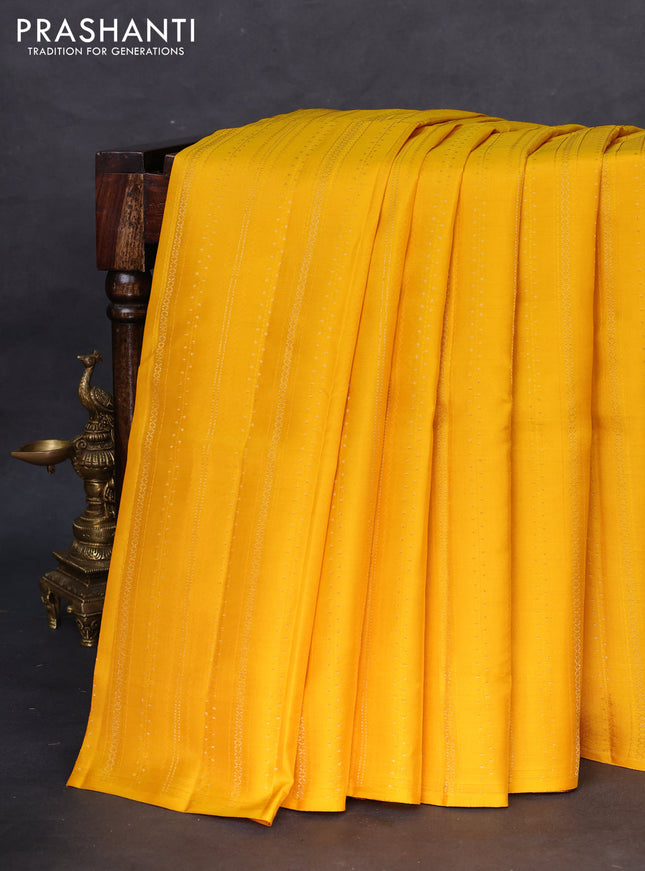 Kanchipuram silk saree yellow and dark pink with allover self emboss & zari weaves in borderless style