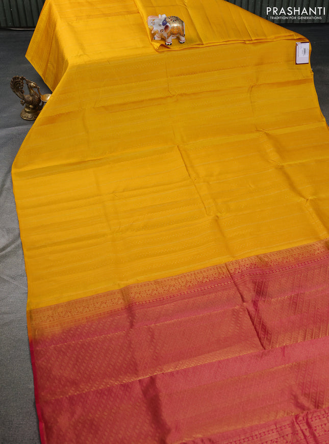 Kanchipuram silk saree yellow and dark pink with allover self emboss & zari weaves in borderless style