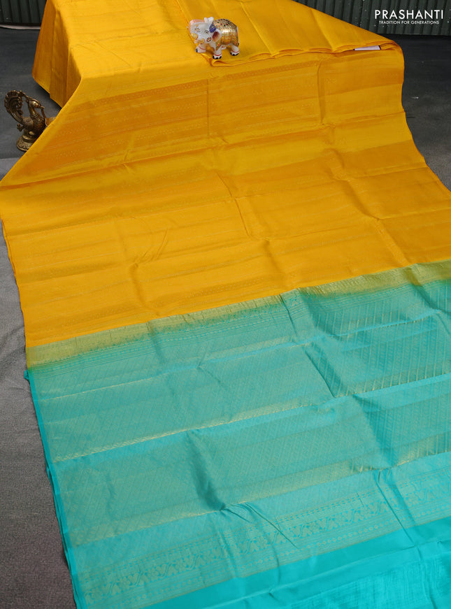 Kanchipuram silk saree yellow and teal shade with allover zari weaves in borderless style