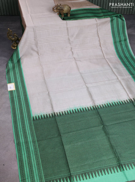 Semi tussar saree beige and green with allover thread weaves and thread woven border