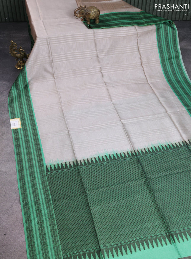 Semi tussar saree beige and green with allover thread weaves and thread woven border