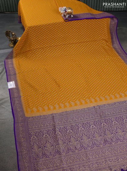 Banarasi georgette saree mustard yellow and blue with allover thread & zari butta weaves and woven border