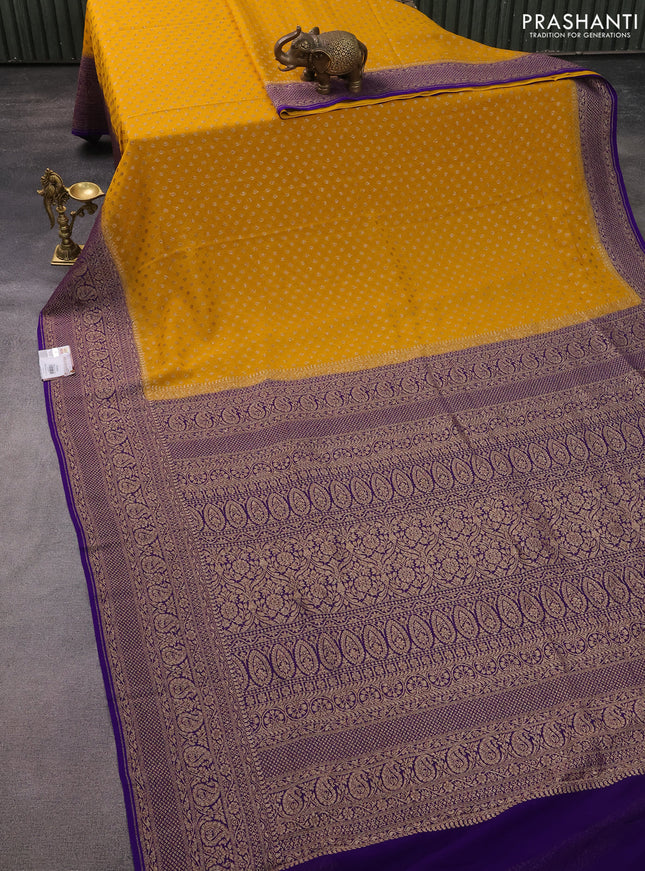 Banarasi georgette saree yelow and violet with allover thread & zari butta weaves and long woven border