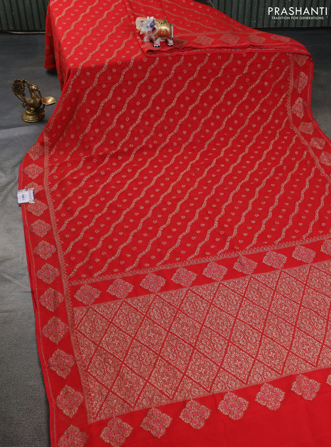Banarasi georgette saree reddish orange with allover thread & zari weaves and woven butta border