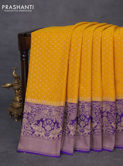 Banarasi georgette saree mustard yellow and violet with allover thread & zari butta weaves and long woven border