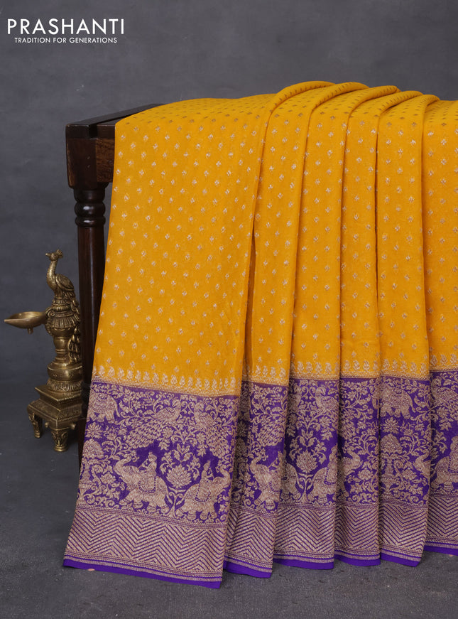 Banarasi georgette saree mustard yellow and violet with allover thread & zari butta weaves and long woven border
