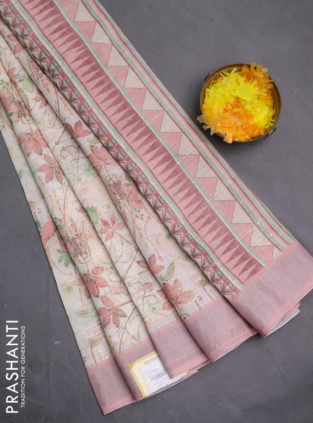 Linen cotton saree cream and peach shade with allover floral pirnts & sequin work and silver zari woven border