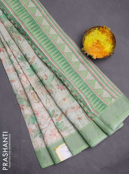 Linen cotton saree ccream and green with allover floral pirnts & sequin work and silver zari woven border