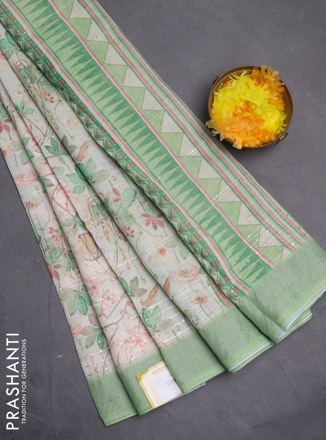 Linen cotton saree ccream and green with allover floral pirnts & sequin work and silver zari woven border