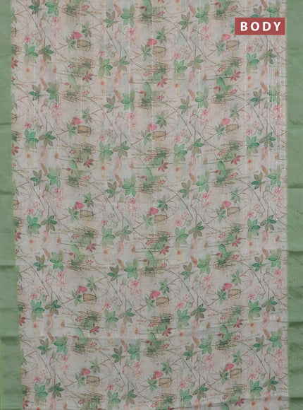 Linen cotton saree ccream and green with allover floral pirnts & sequin work and silver zari woven border