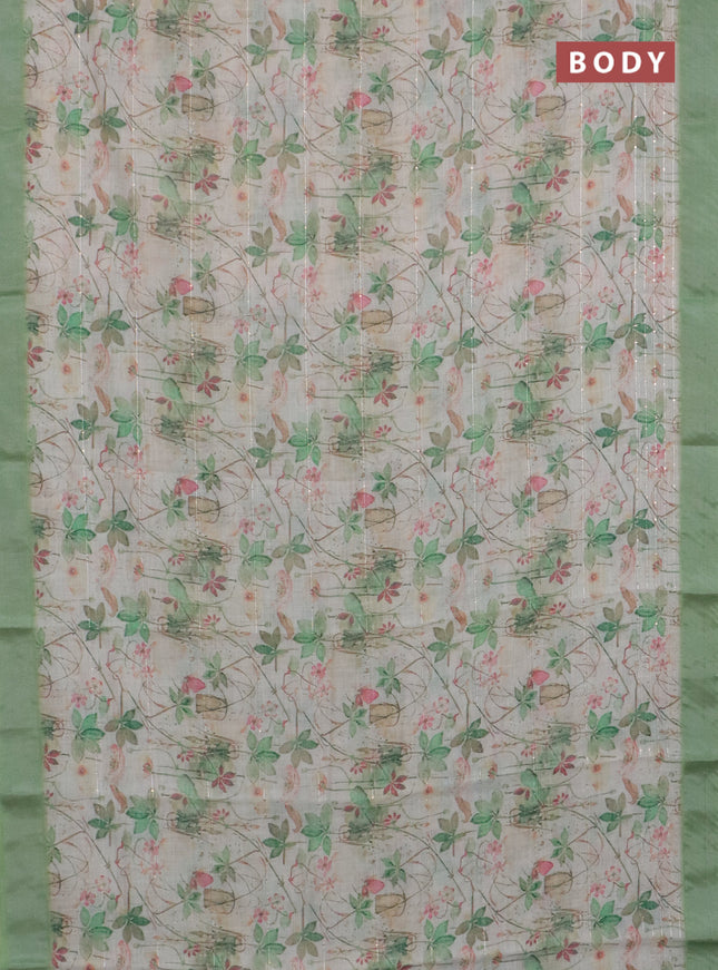 Linen cotton saree ccream and green with allover floral pirnts & sequin work and silver zari woven border