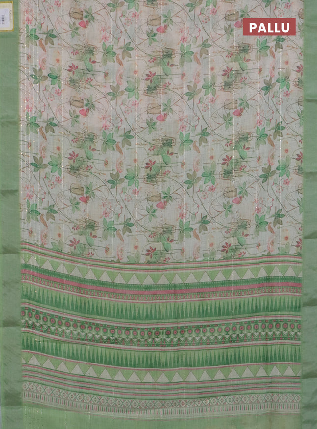 Linen cotton saree ccream and green with allover floral pirnts & sequin work and silver zari woven border