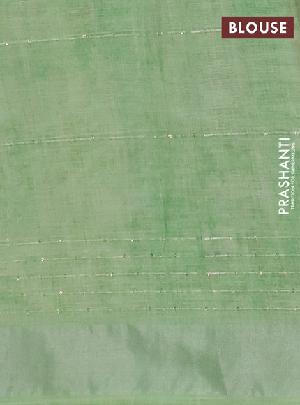 Linen cotton saree ccream and green with allover floral pirnts & sequin work and silver zari woven border