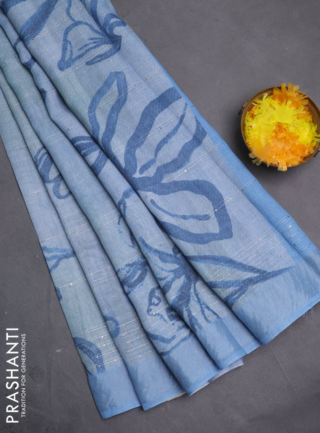 Linen cotton saree bluish grey with allover floral pirnts & sequin work and silver zari woven border