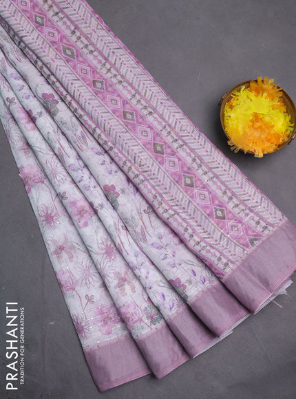 Linen cotton saree off white and pastel pink with allover floral pirnts & sequin work and silver zari woven border
