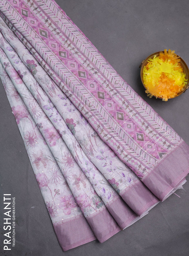 Linen cotton saree off white and pastel pink with allover floral pirnts & sequin work and silver zari woven border