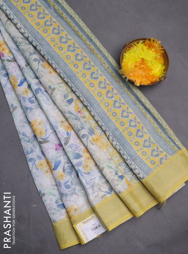Linen cotton saree off white and yellow with allover floral prints & sequin work and silver zari woven border