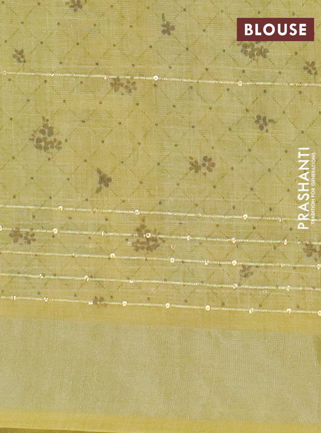 Linen cotton saree off white and yellow with allover floral prints & sequin work and silver zari woven border