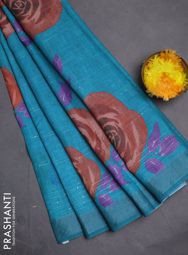 Linen cotton saree teal green with allover floral prints & sequin work and silver zari woven border