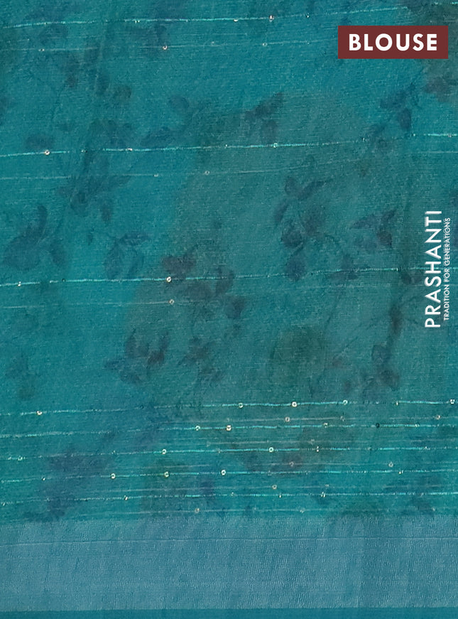 Linen cotton saree teal green with allover floral prints & sequin work and silver zari woven border