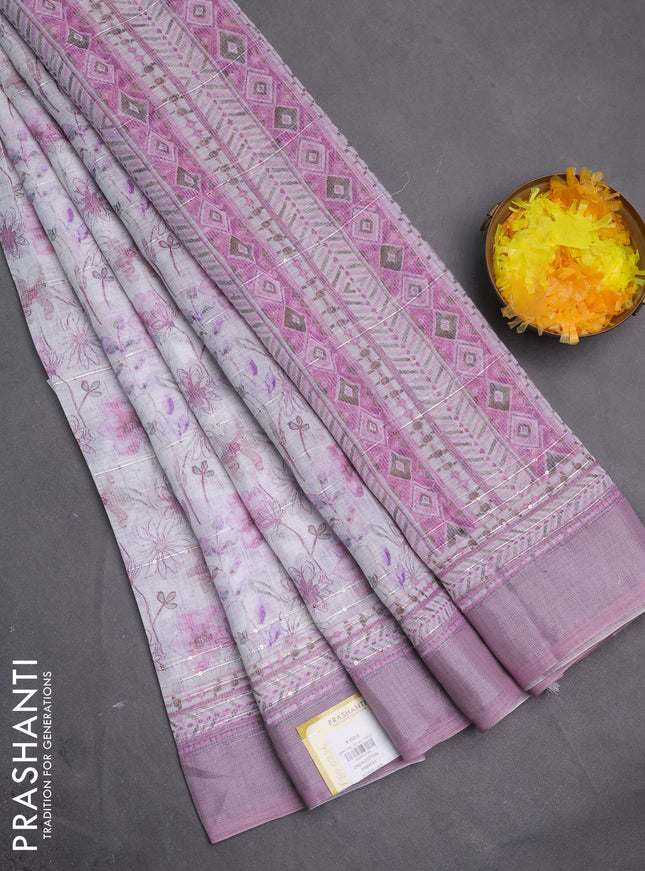 Linen cotton saree off white and pastel pink with allover floral prints & sequin work and silver zari woven border