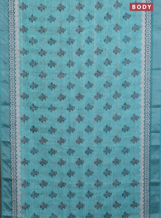 Linen cotton saree teal shade with floral butta prints & sequin work and silver zari woven border