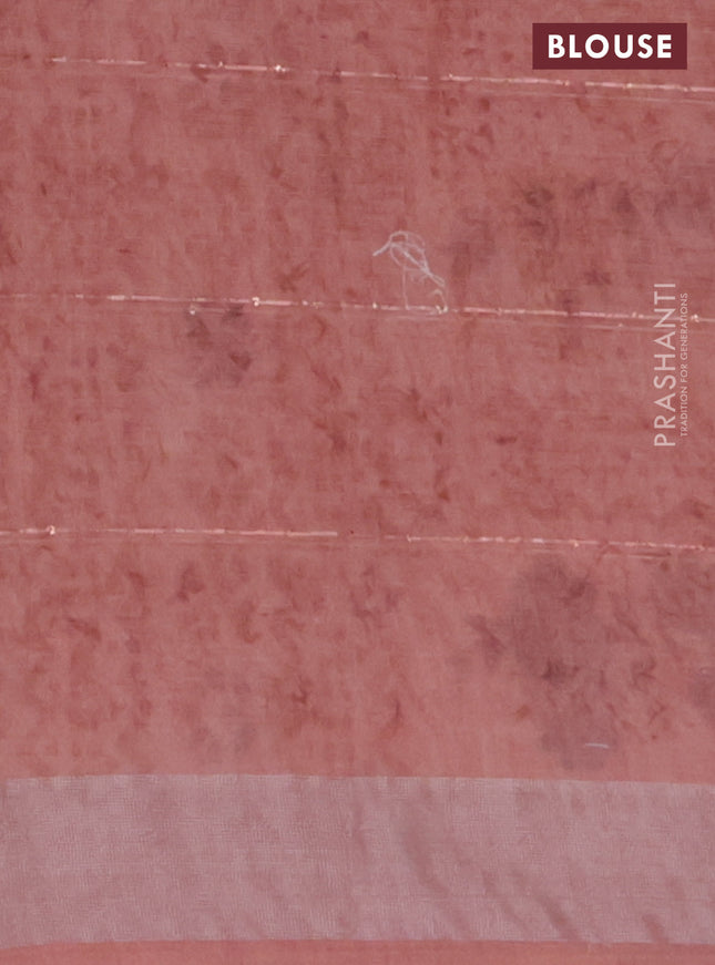 Linen cotton saree peach shade with floral butta prints & sequin work and silver zari woven border