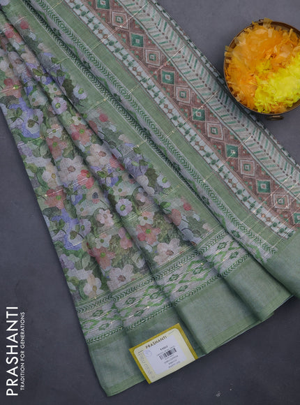 Linen cotton saree pastel green with allover floral prints & sequin work and silver zari woven border